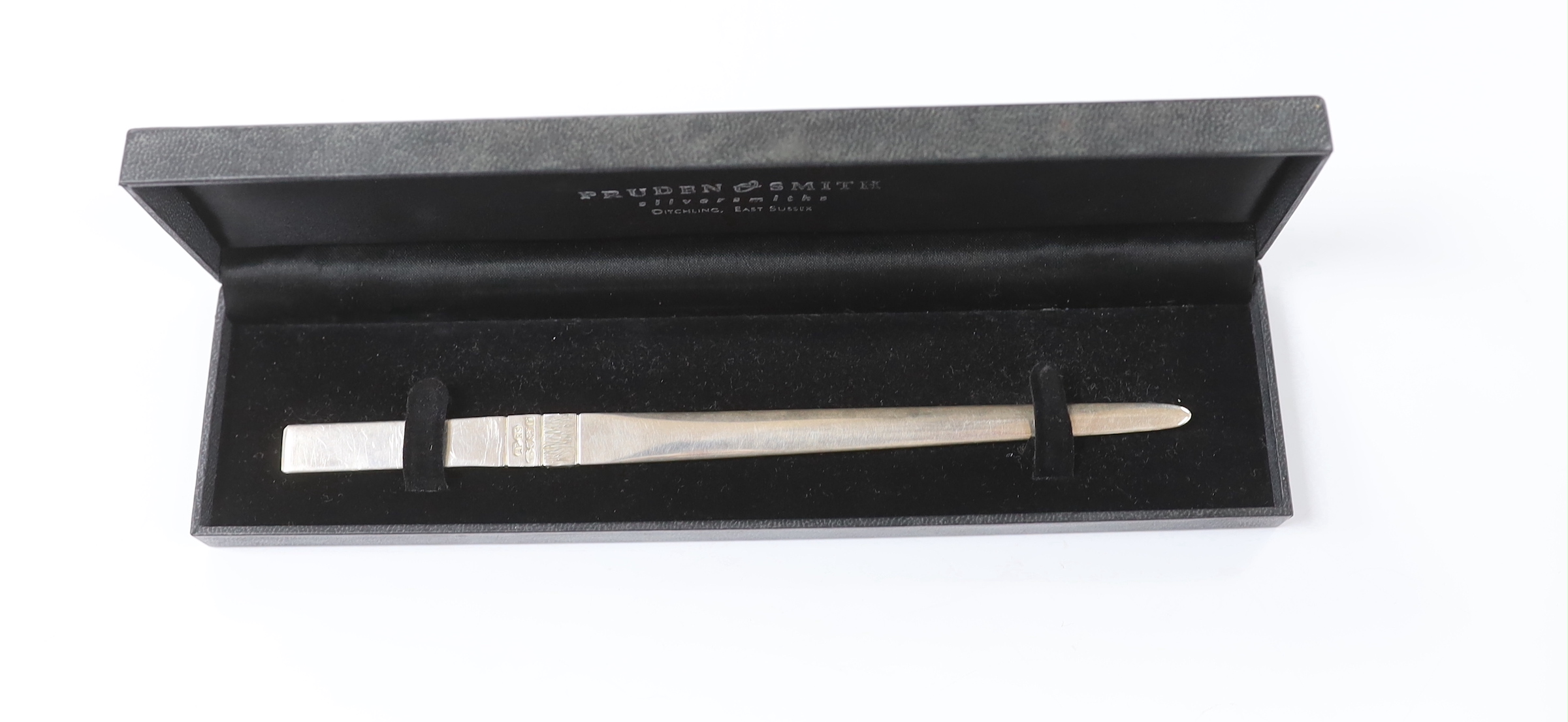 An Elizabeth II part textured silver paper knife, by Pruden & Smith, Sheffield, 2005, 18.4cm, 46 grams, with original box.